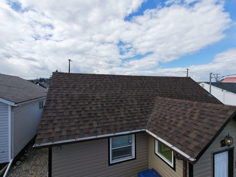 Drone view of brown shingle roof on Cranbrook home after NuRoof treatment