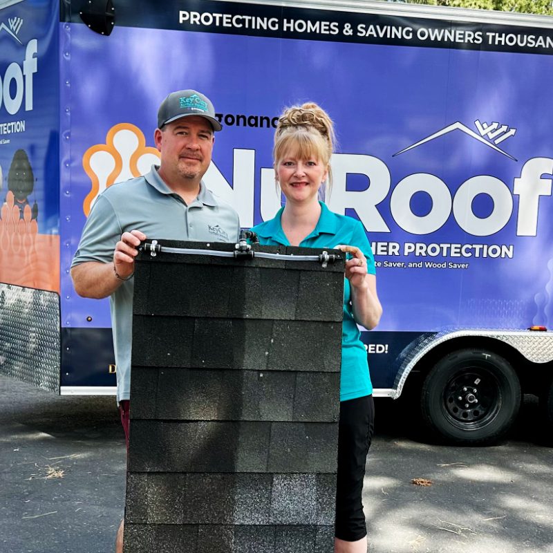 Jeff and Crystal in front of the NuRoof trailer.